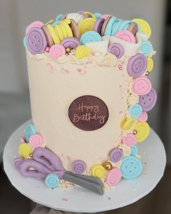 Pastel sewing themed cake 🧵🪡

This one is super different and I will be happy to not make another button for a while but LOVE the result of this🥰

All decor made out of fondant icing🤍